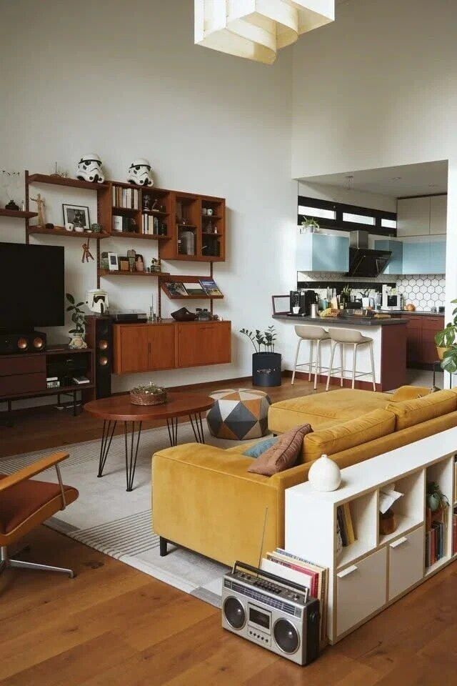 Main salon with fireplace, long sightlines, and garden doors.