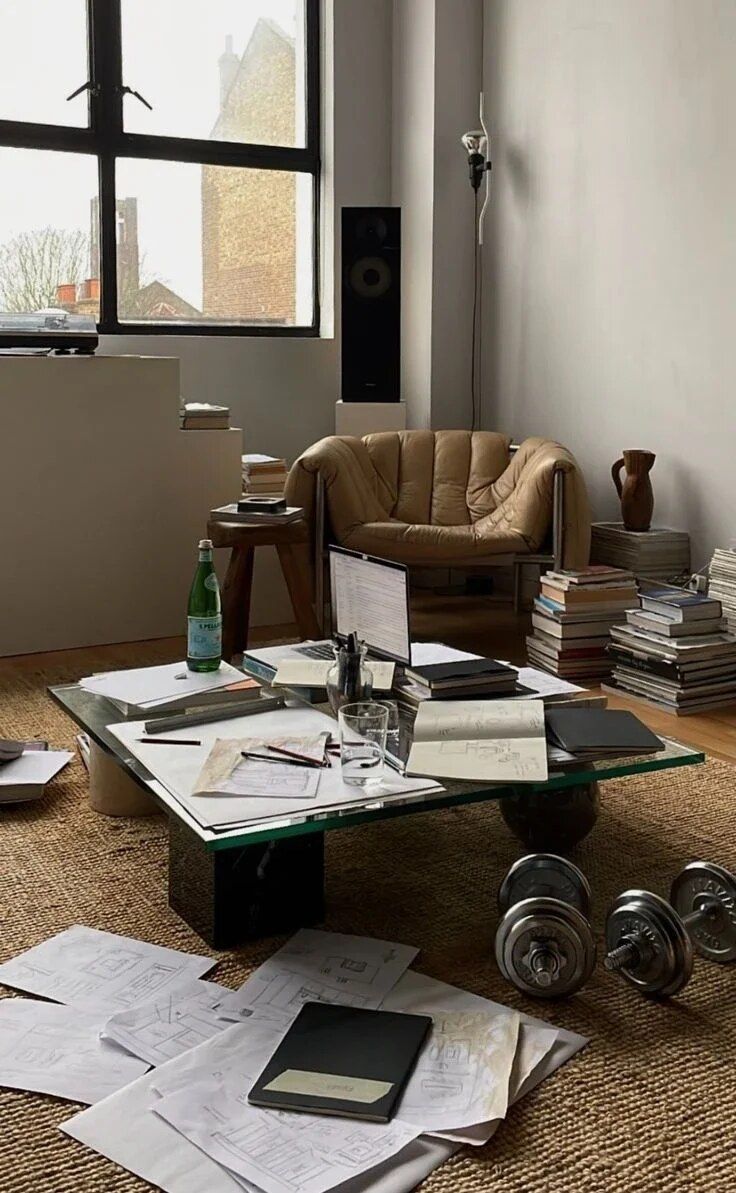 Living and dining area with wide windows and warm flooring.